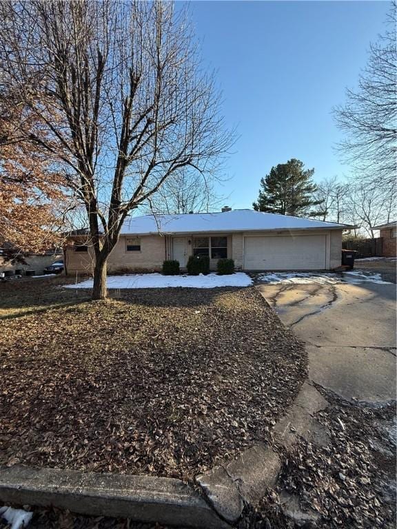 ranch-style house featuring a garage