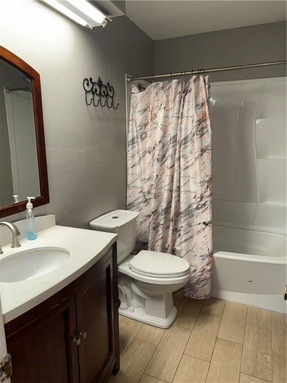 full bathroom with toilet, vanity, and shower / bathtub combination with curtain