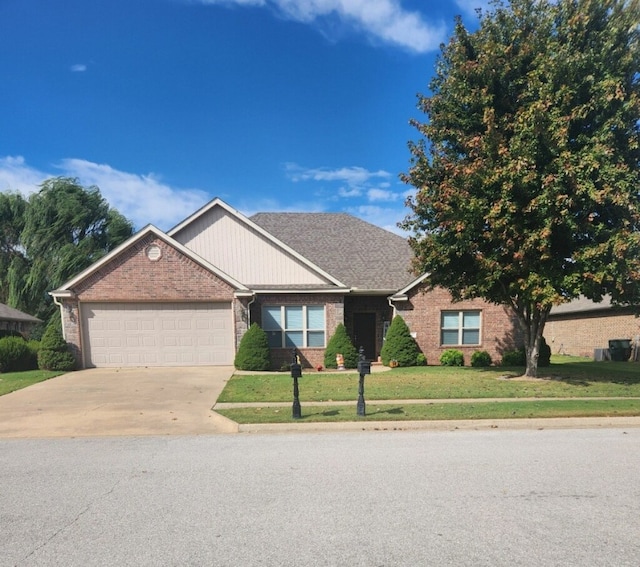 view of front of property with a front lawn and a garage