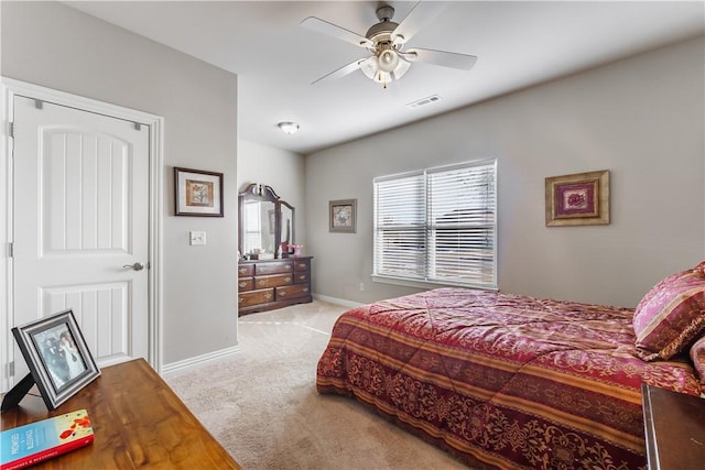 bedroom with ceiling fan and light colored carpet