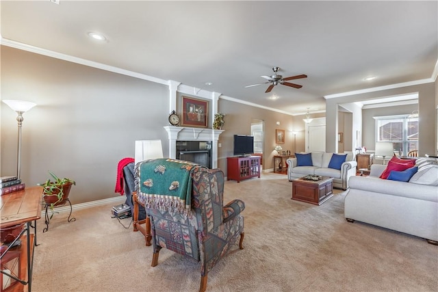 living room featuring light colored carpet, ceiling fan, and ornamental molding