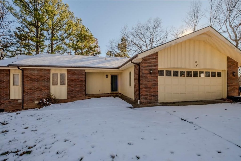 single story home featuring a garage