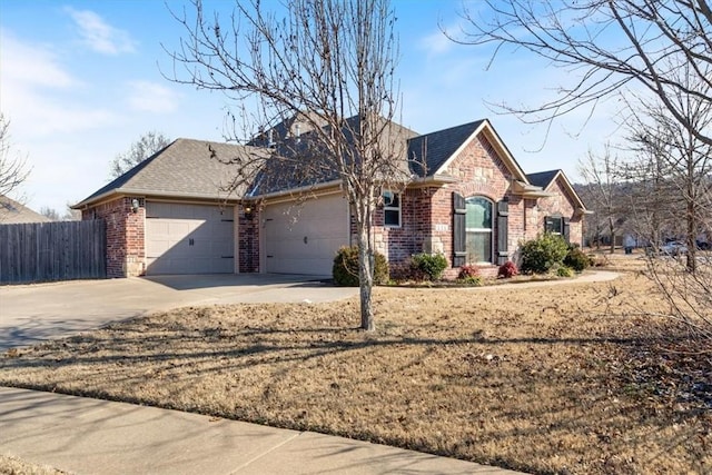 view of front of property with a garage