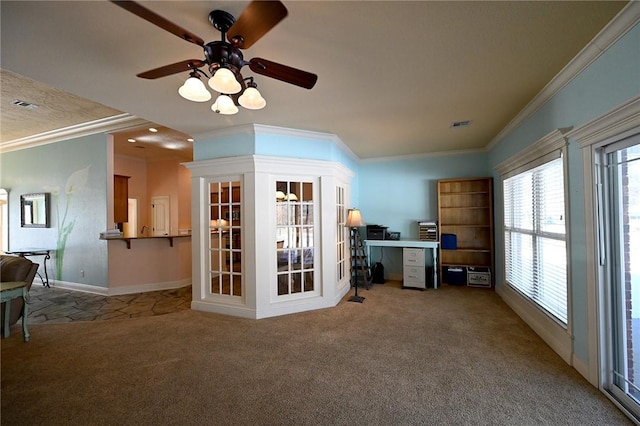 interior space featuring ceiling fan and crown molding