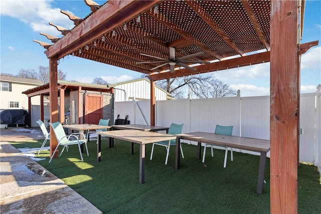 view of patio with a grill, fence, and a pergola