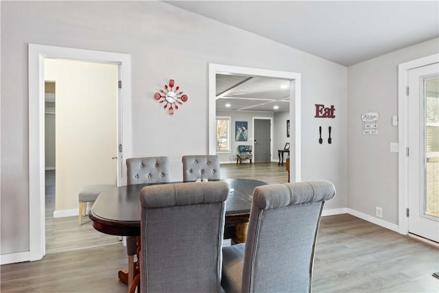 dining space with hardwood / wood-style floors