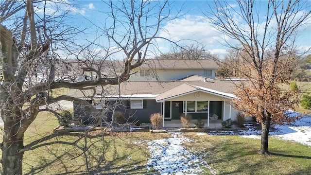 13693 N Mount Pleasant Rd, Gravette, AR 72736 - view of front of house featuring a front lawn, a sunroom, and roof with shingles