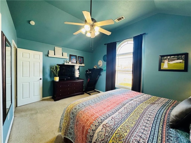 bedroom with visible vents, carpet floors, baseboards, ceiling fan, and vaulted ceiling