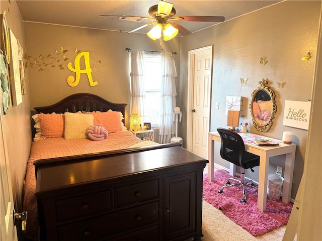 carpeted bedroom with ceiling fan