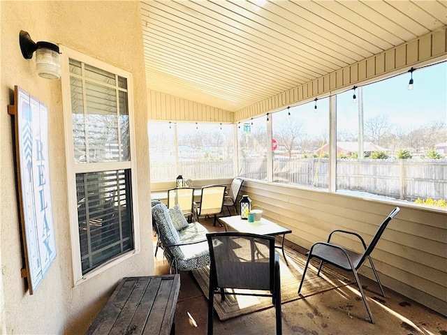 sunroom / solarium with lofted ceiling and wood ceiling