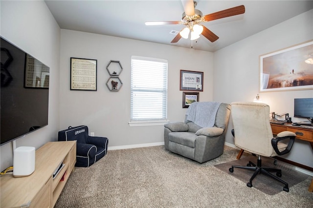 carpeted home office with ceiling fan