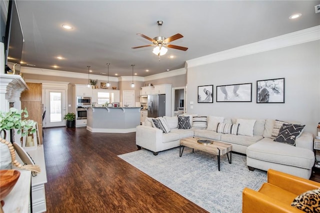 living room featuring ceiling fan, crown molding, and dark hardwood / wood-style flooring