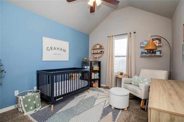 bedroom featuring lofted ceiling, a nursery area, carpet floors, and ceiling fan