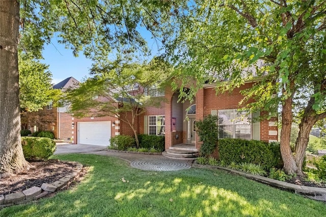 view of front of home featuring a front lawn and a garage