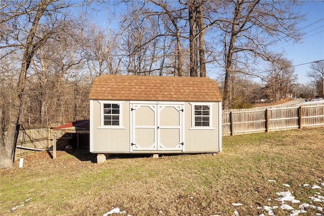 view of outbuilding featuring a yard