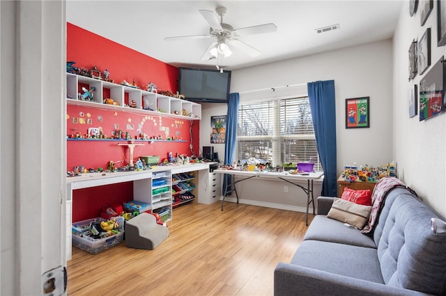 interior space with hardwood / wood-style floors and ceiling fan