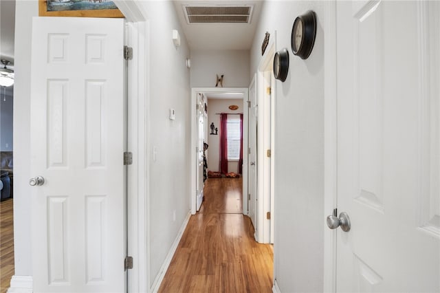 hall with light wood-type flooring