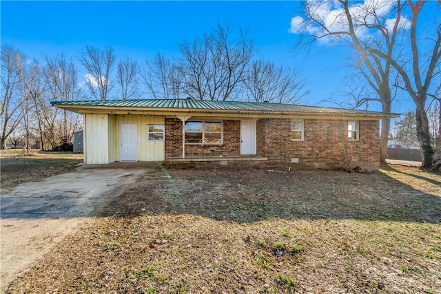 ranch-style home featuring a carport