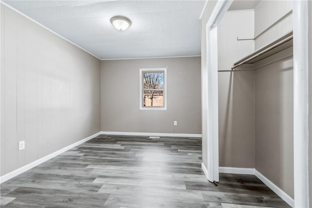 unfurnished bedroom with a closet and hardwood / wood-style floors