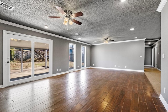 spare room with ornamental molding, a textured ceiling, and ceiling fan