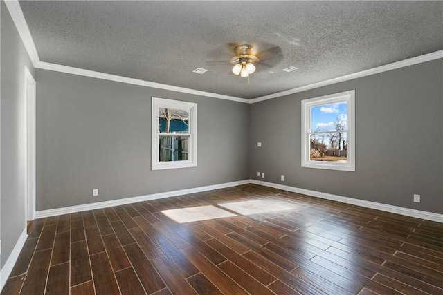 spare room featuring ornamental molding, a textured ceiling, and ceiling fan