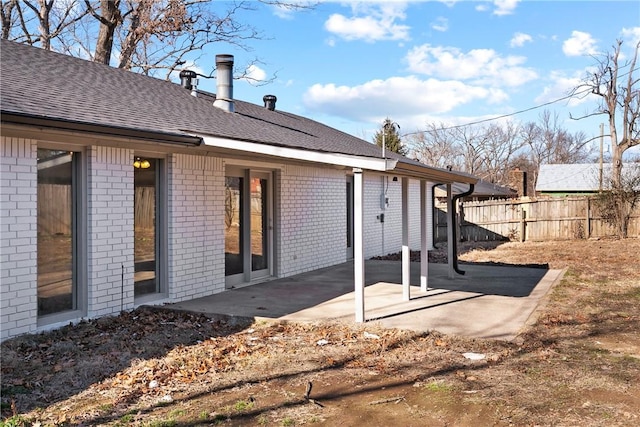 rear view of property featuring a patio