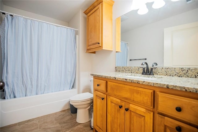 full bathroom with shower / bath combo with shower curtain, vanity, and toilet