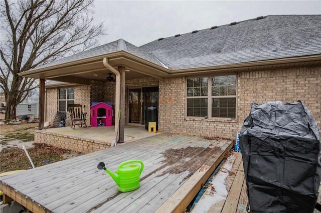 wooden deck with a patio area