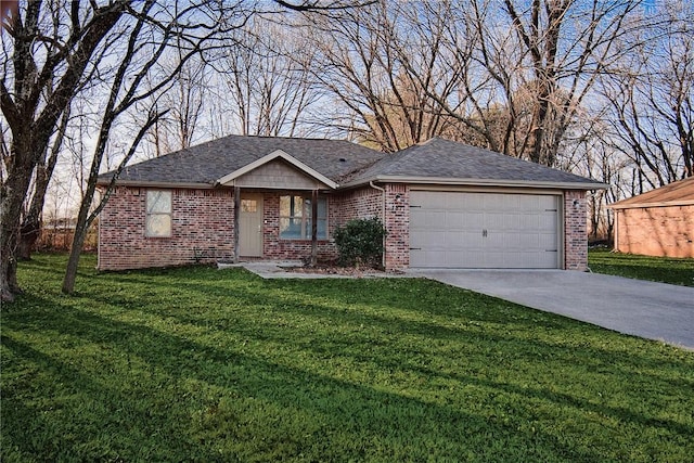 ranch-style house with a garage and a front lawn