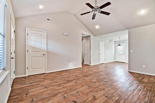 unfurnished room with ceiling fan, dark wood-type flooring, and lofted ceiling