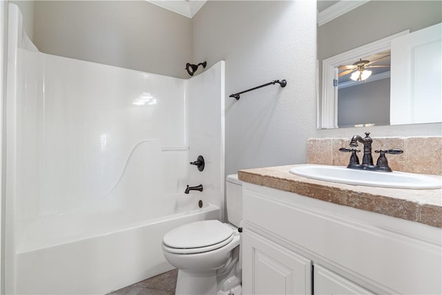 full bathroom featuring toilet, crown molding, vanity, ceiling fan, and bathing tub / shower combination