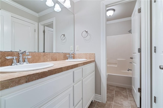 bathroom with ornamental molding, tile patterned floors,  shower combination, and vanity