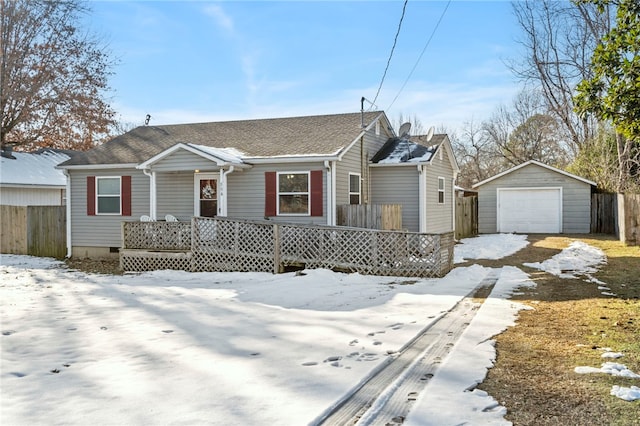 view of front of home featuring a garage and an outdoor structure