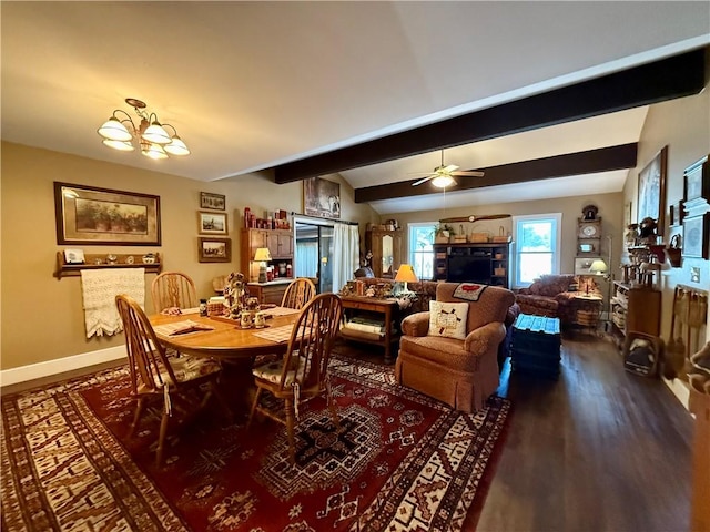 dining room with ceiling fan with notable chandelier, beamed ceiling, and hardwood / wood-style floors