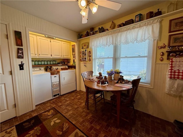 dining space with ceiling fan and washer and clothes dryer