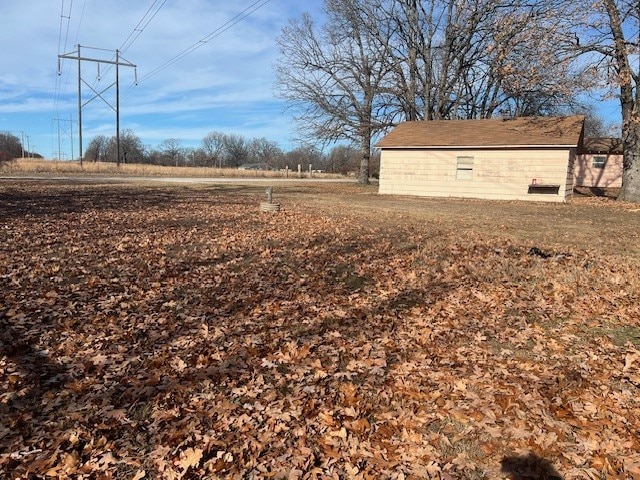 view of yard with a rural view