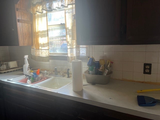 kitchen with sink and tasteful backsplash