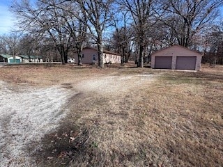 view of yard with a garage