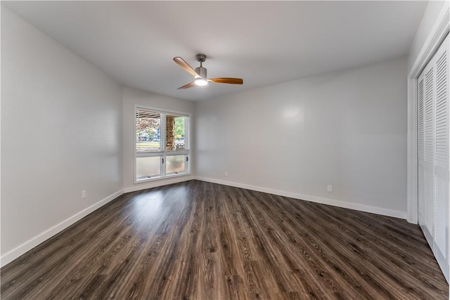 unfurnished bedroom with ceiling fan, a closet, and dark hardwood / wood-style floors