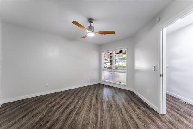 empty room with dark wood-type flooring and ceiling fan