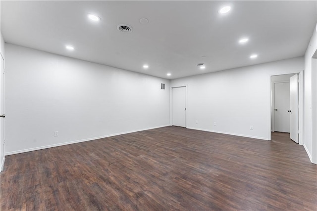 unfurnished room featuring dark wood-type flooring