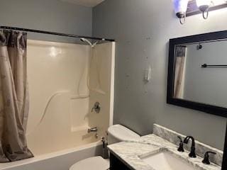 full bathroom featuring shower / bathtub combination with curtain, vanity, and toilet