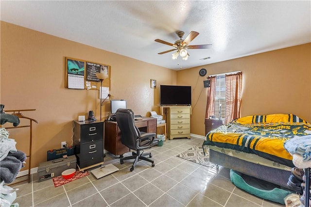 bedroom with ceiling fan and tile patterned flooring