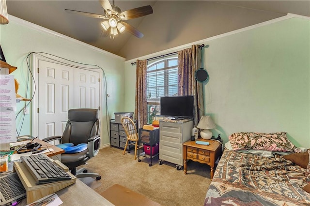 carpeted home office with vaulted ceiling, ceiling fan, and crown molding