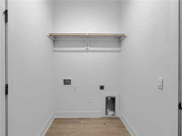 laundry area featuring washer hookup, light hardwood / wood-style flooring, and hookup for an electric dryer