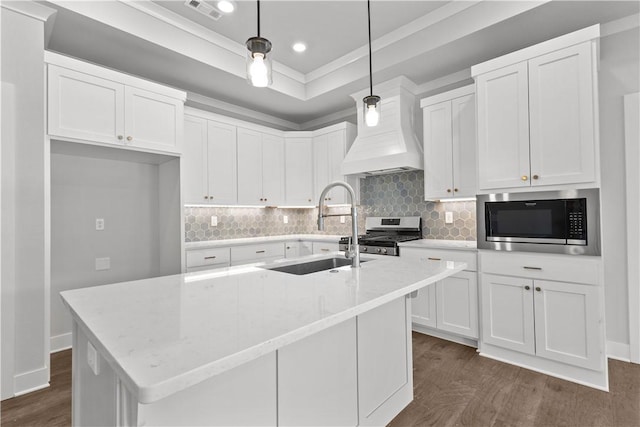 kitchen with stainless steel appliances, light stone countertops, hanging light fixtures, and white cabinets