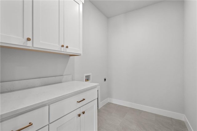 laundry area with cabinets, washer hookup, and hookup for an electric dryer