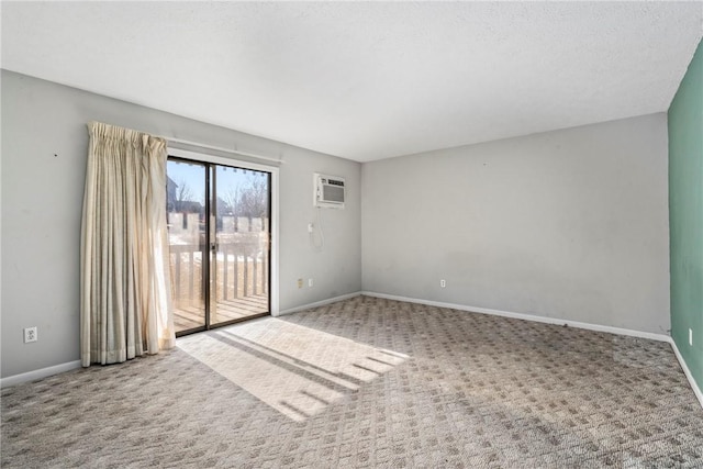 carpeted empty room with a wall unit AC