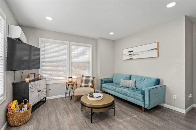 living room with wood-type flooring and a wall mounted AC