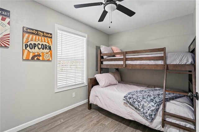 bedroom featuring hardwood / wood-style flooring and ceiling fan